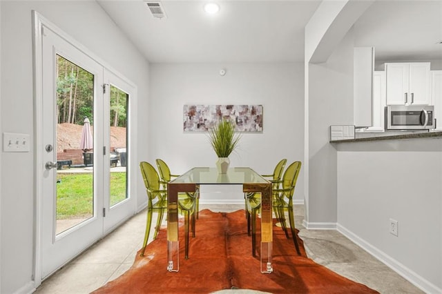 6571 Splitpine Ct, Atlanta, GA 30349 - dining area with healthy amount of natural light and baseboards