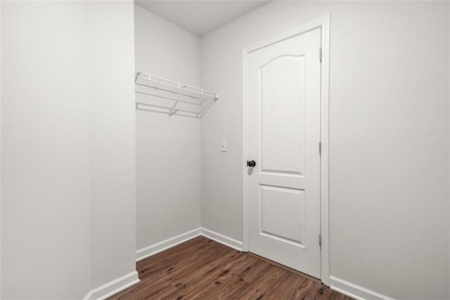 6571 Splitpine Ct, Atlanta, GA 30349 - walk in closet featuring dark wood-style flooring