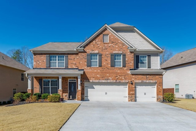 craftsman-style house with brick siding, driveway, an attached garage, and central AC unit