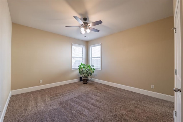 carpeted empty room featuring a ceiling fan and baseboards