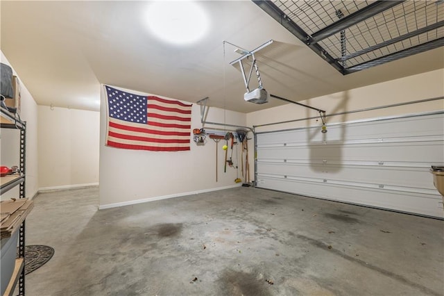 garage with baseboards and a garage door opener