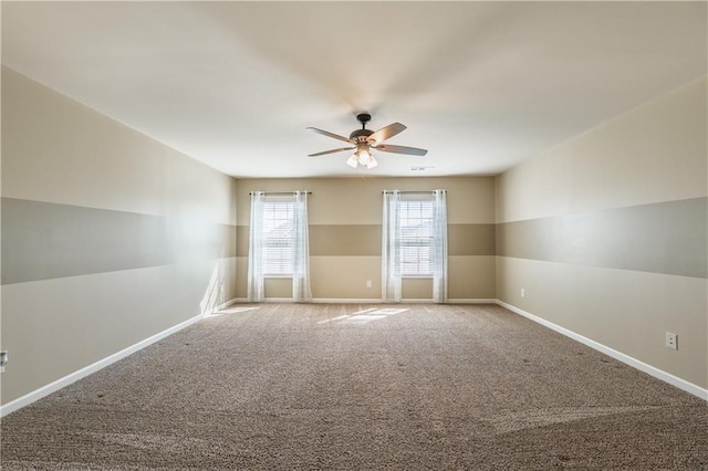 empty room featuring a ceiling fan, baseboards, and carpet flooring