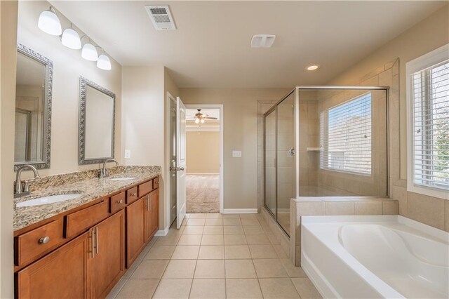 bathroom featuring a shower stall, visible vents, a sink, and tile patterned floors