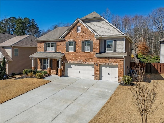 craftsman house featuring a garage, brick siding, covered porch, and fence