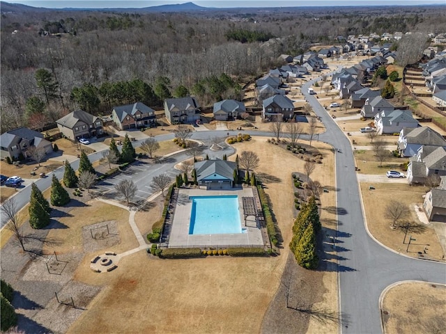 bird's eye view with a residential view and a wooded view