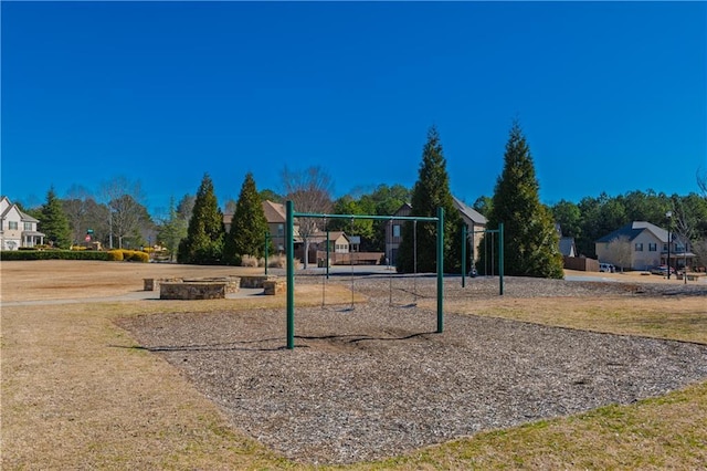 communal playground featuring a lawn