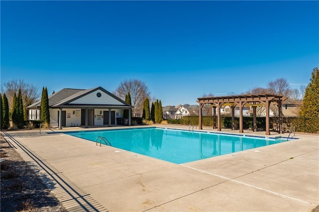 pool featuring a patio, fence, and a pergola