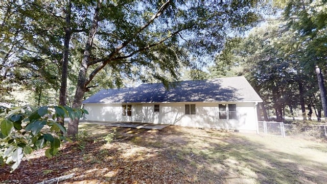 view of front of property featuring fence and crawl space