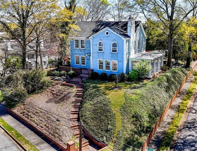 colonial inspired home with a front yard