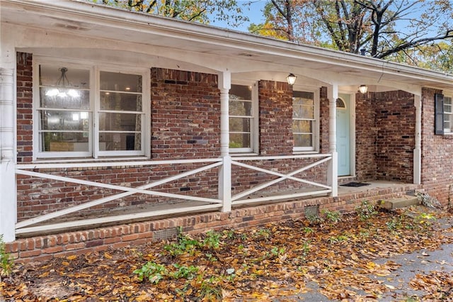 doorway to property featuring a porch