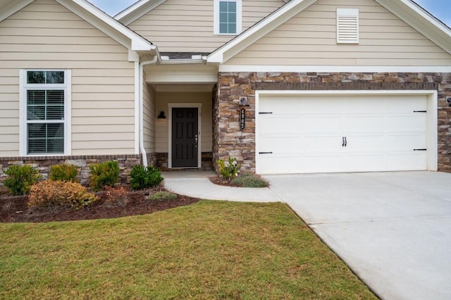 view of front facade with stone siding, a front lawn, concrete driveway, and a garage