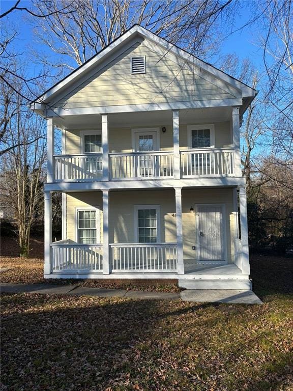 view of front of house featuring a balcony