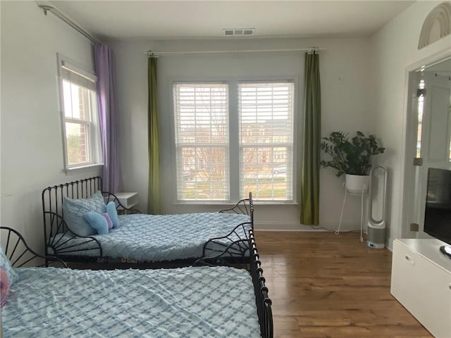 bedroom featuring hardwood / wood-style floors