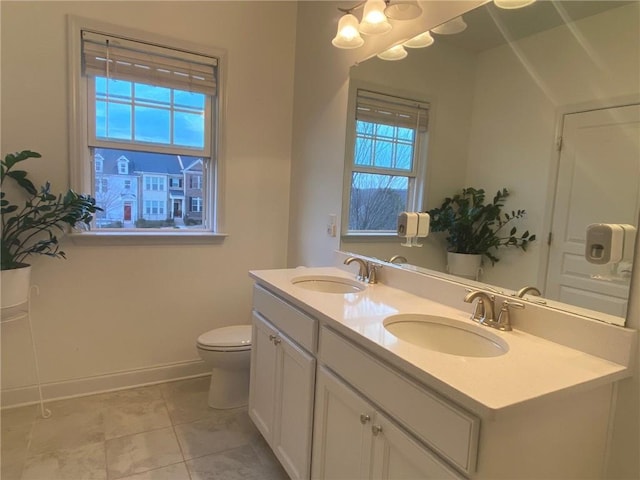 bathroom featuring vanity, toilet, and tile patterned floors