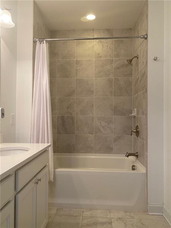 bathroom featuring tile patterned floors, vanity, and shower / bath combination with curtain