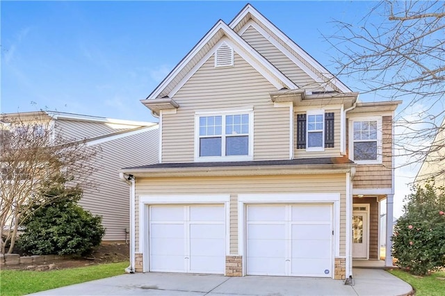 view of front of home featuring an attached garage and driveway