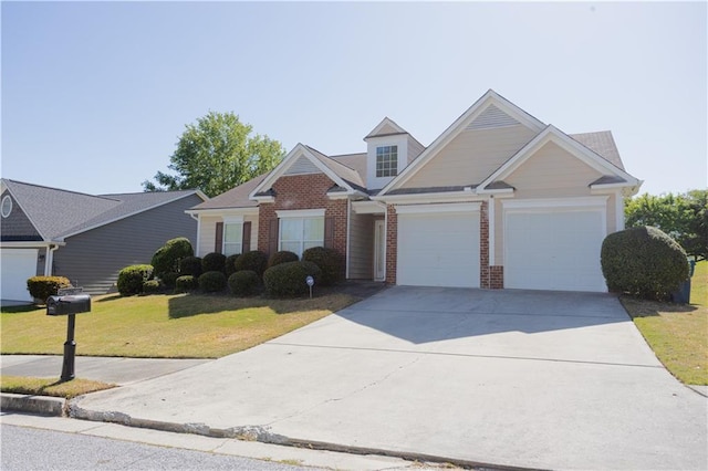 traditional home featuring a garage, brick siding, a front yard, and driveway
