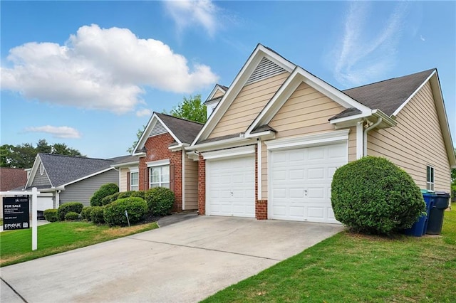 view of front facade with concrete driveway, brick siding, a garage, and a front lawn