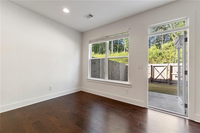 empty room featuring dark hardwood / wood-style floors