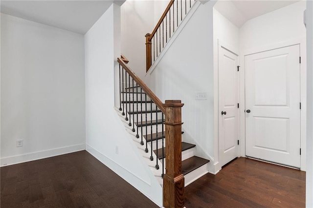 stairs with hardwood / wood-style flooring