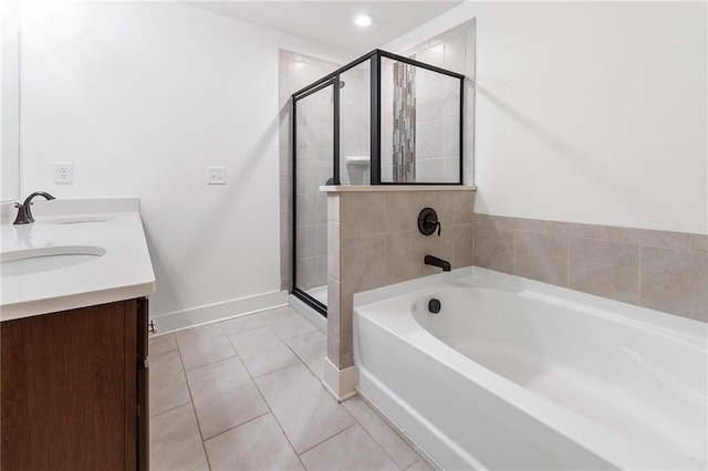 bathroom with vanity, tile patterned floors, and independent shower and bath