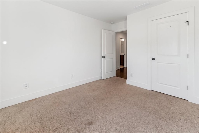 unfurnished bedroom with carpet floors