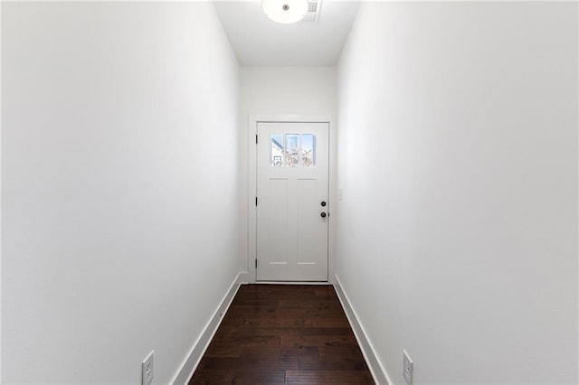 doorway to outside with dark wood-type flooring