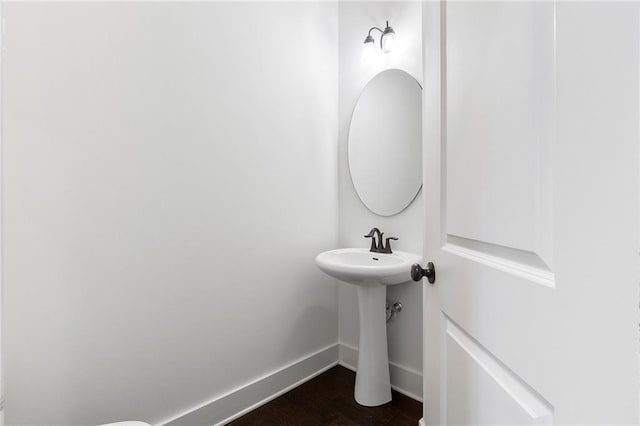 bathroom featuring wood-type flooring