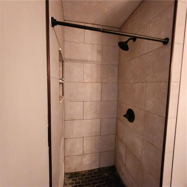 full bathroom featuring toilet, vanity, tile patterned flooring, and tiled shower / bath