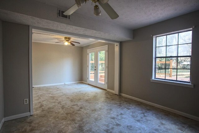 doorway featuring ceiling fan, ornamental molding, and french doors