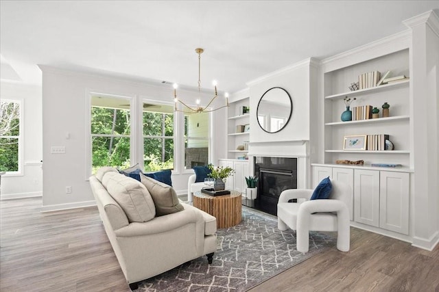 living room featuring ornamental molding, a healthy amount of sunlight, and hardwood / wood-style floors