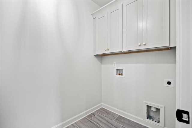 laundry room featuring cabinets, hookup for an electric dryer, and hookup for a washing machine