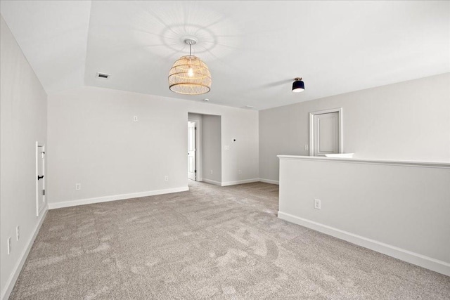 empty room featuring light colored carpet