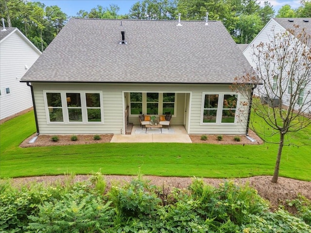 back of property featuring a yard and a patio area