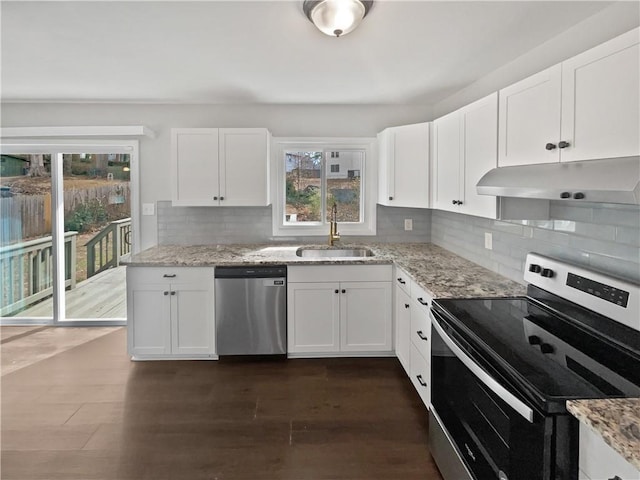 kitchen with white cabinetry, light stone countertops, and appliances with stainless steel finishes