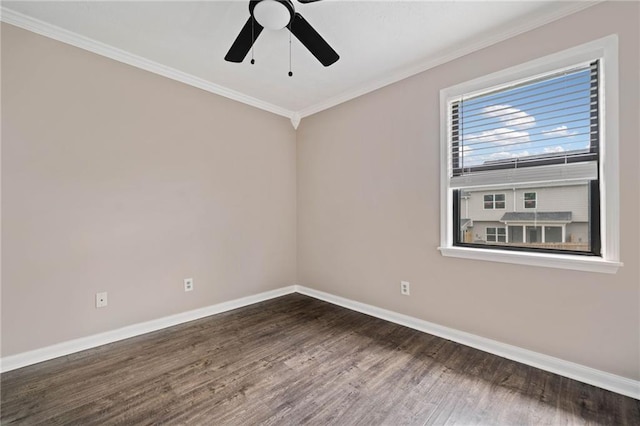 spare room featuring baseboards, ceiling fan, ornamental molding, and wood finished floors