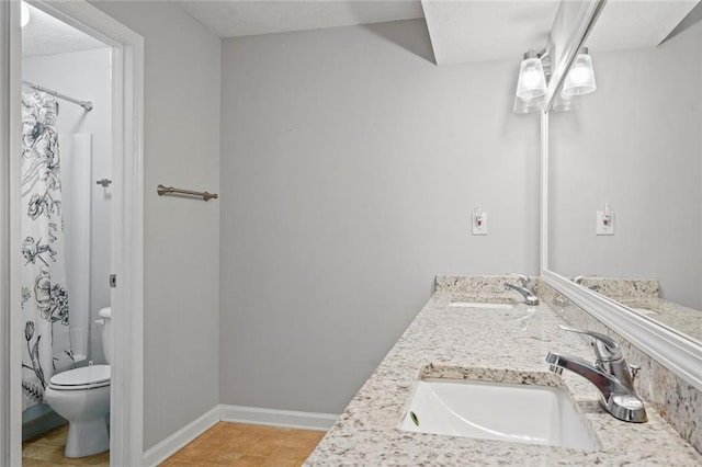 212 Brittany Ct, Duluth, GA 30096 - bathroom with toilet, double vanity, baseboards, and a shower with curtain