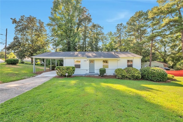 ranch-style home featuring a front yard and a carport