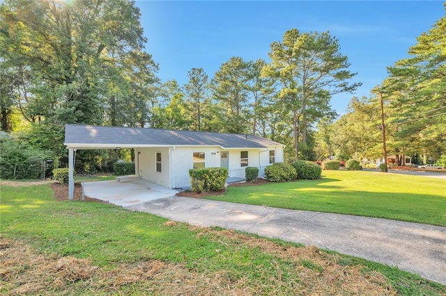 view of front of house with a front yard and a carport