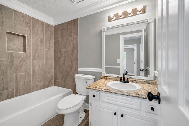 bathroom with shower / bathing tub combination, a textured ceiling, crown molding, vanity, and toilet