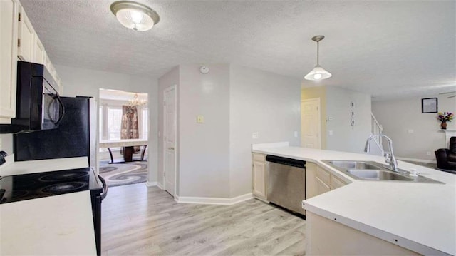 kitchen with white electric range oven, sink, decorative light fixtures, light hardwood / wood-style flooring, and dishwasher