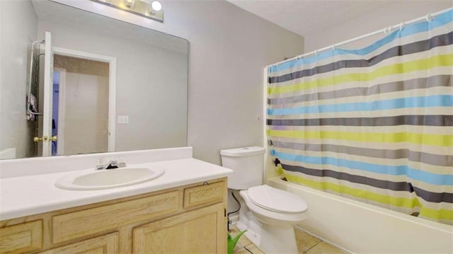 full bathroom with tile patterned flooring, vanity, shower / bath combo, and toilet