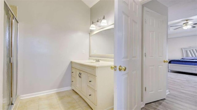 bathroom featuring walk in shower, ceiling fan, vanity, and hardwood / wood-style flooring