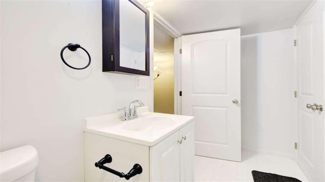 bathroom featuring vanity and toilet