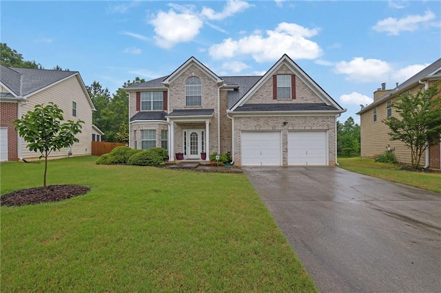 traditional home featuring concrete driveway, a front yard, and brick siding
