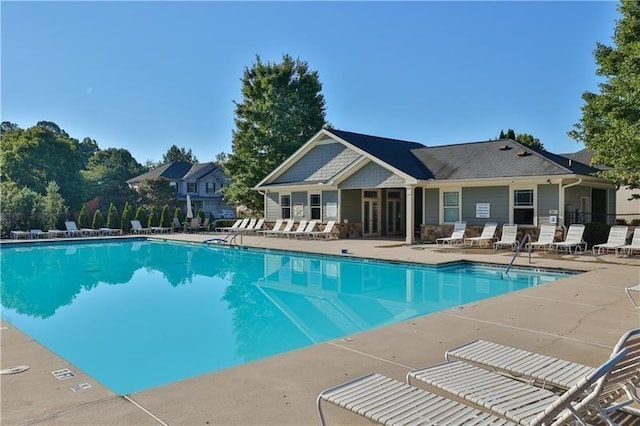 community pool with a patio area