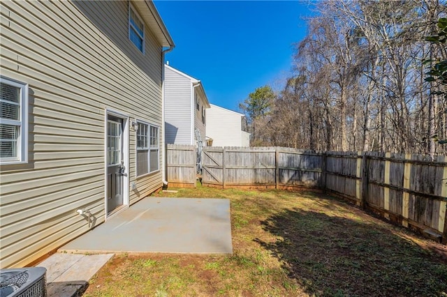 view of yard featuring central AC unit and a patio area