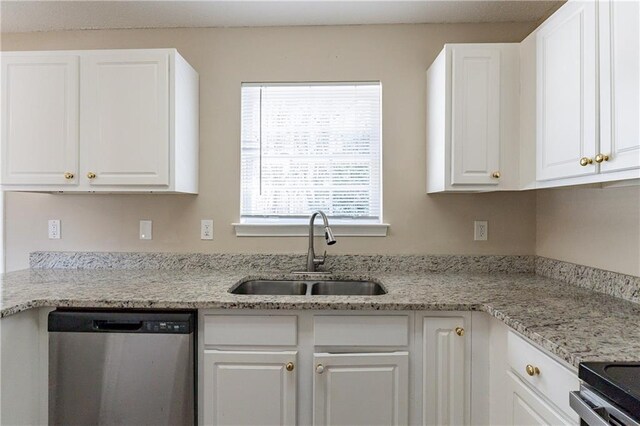 kitchen with white cabinetry, sink, light stone countertops, and dishwasher