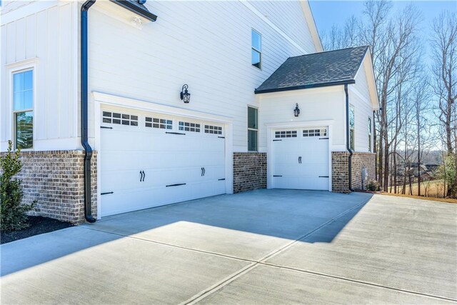 view of side of home with a garage