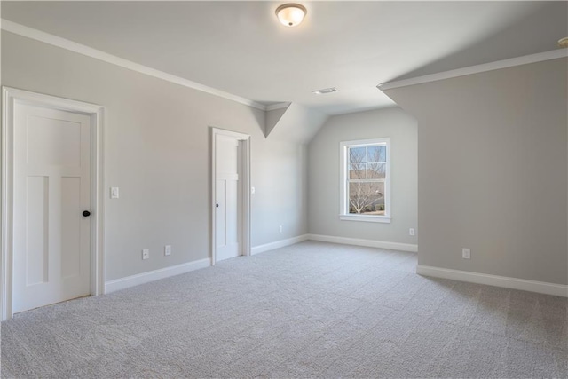 additional living space with vaulted ceiling and light colored carpet